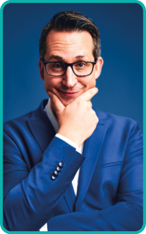 Zauberer Andreas Fleckenstein Zauberer Andreaas Fleckenstein trägt einen blaues Jackett und stützt seine Hand ans Kinn.